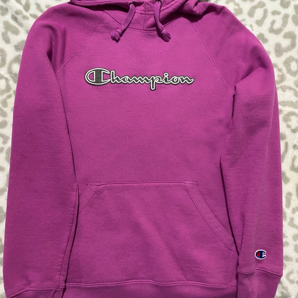 Womens Champion purple hoodie with “Champion” logo on chest.